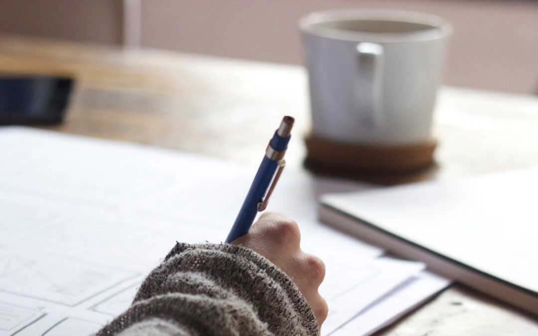 person writing with coffee 1800×883