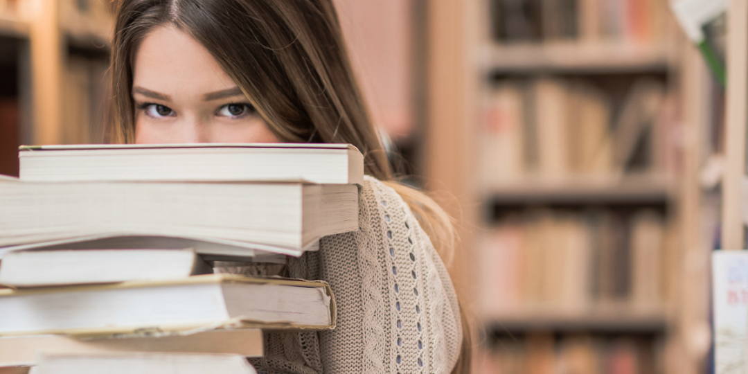 banner girl stack of books library
